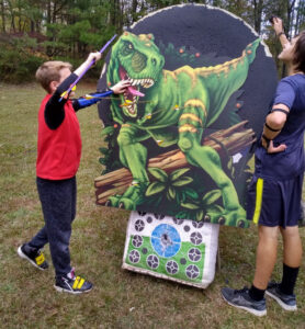 Another Halloween fun shoot. This is a cardboard T-REX attached to the target. The two boys are retrieving their arrows from it.