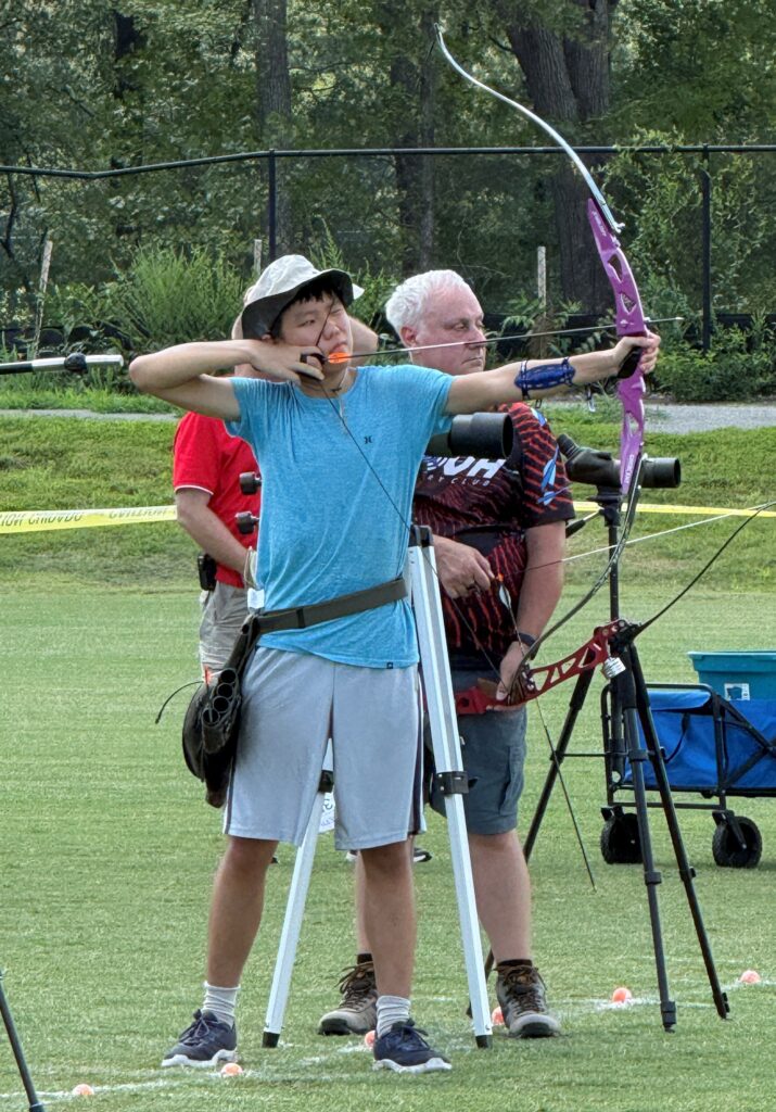 VaState2026-3 Youth archer at full draw with a barebow