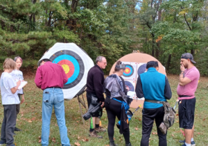 Archers scoring the arrows on their targets